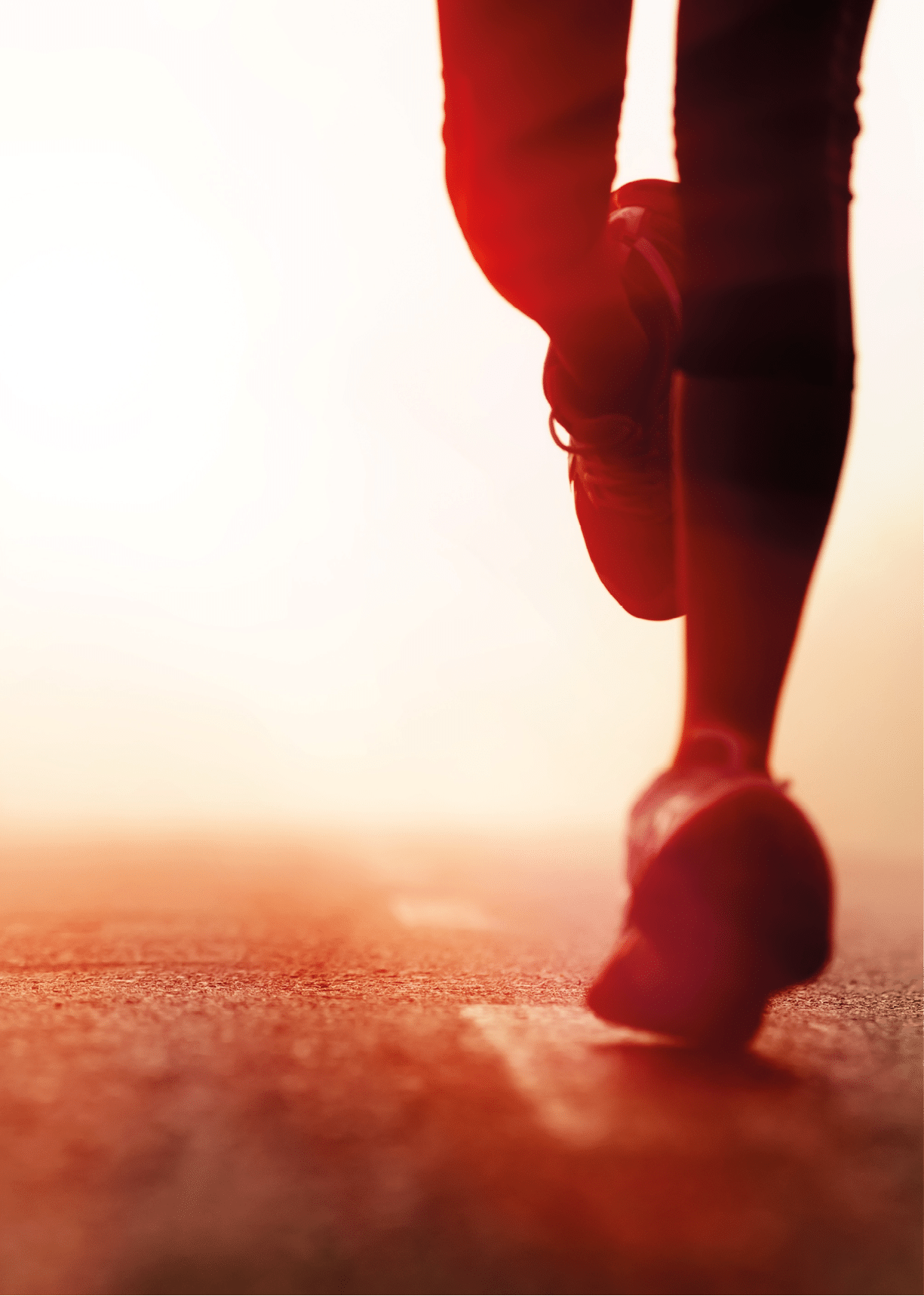 Runner athlete feet running on road. woman fitness silhouette sunrise jog workout wellness concept.