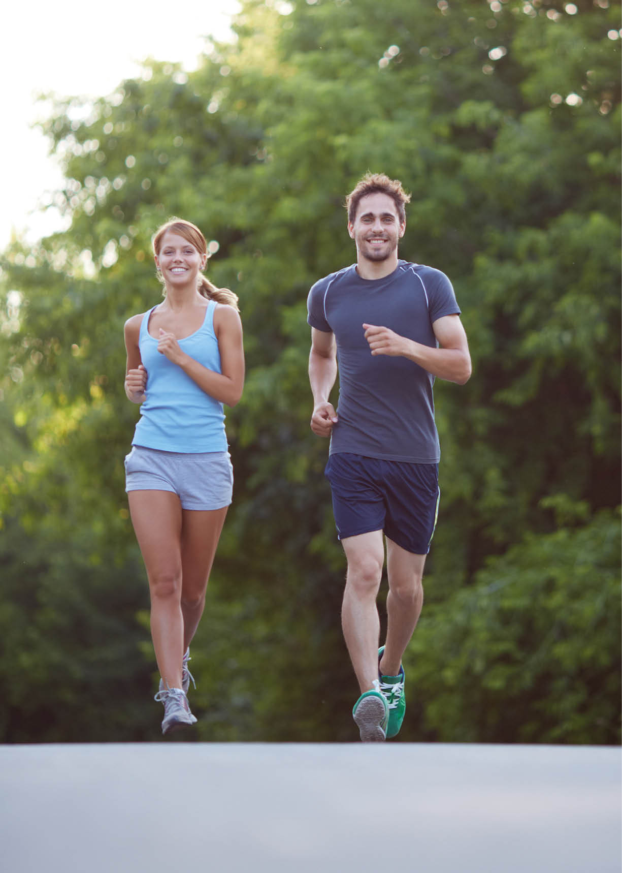 Photo of happy couple running outdoors